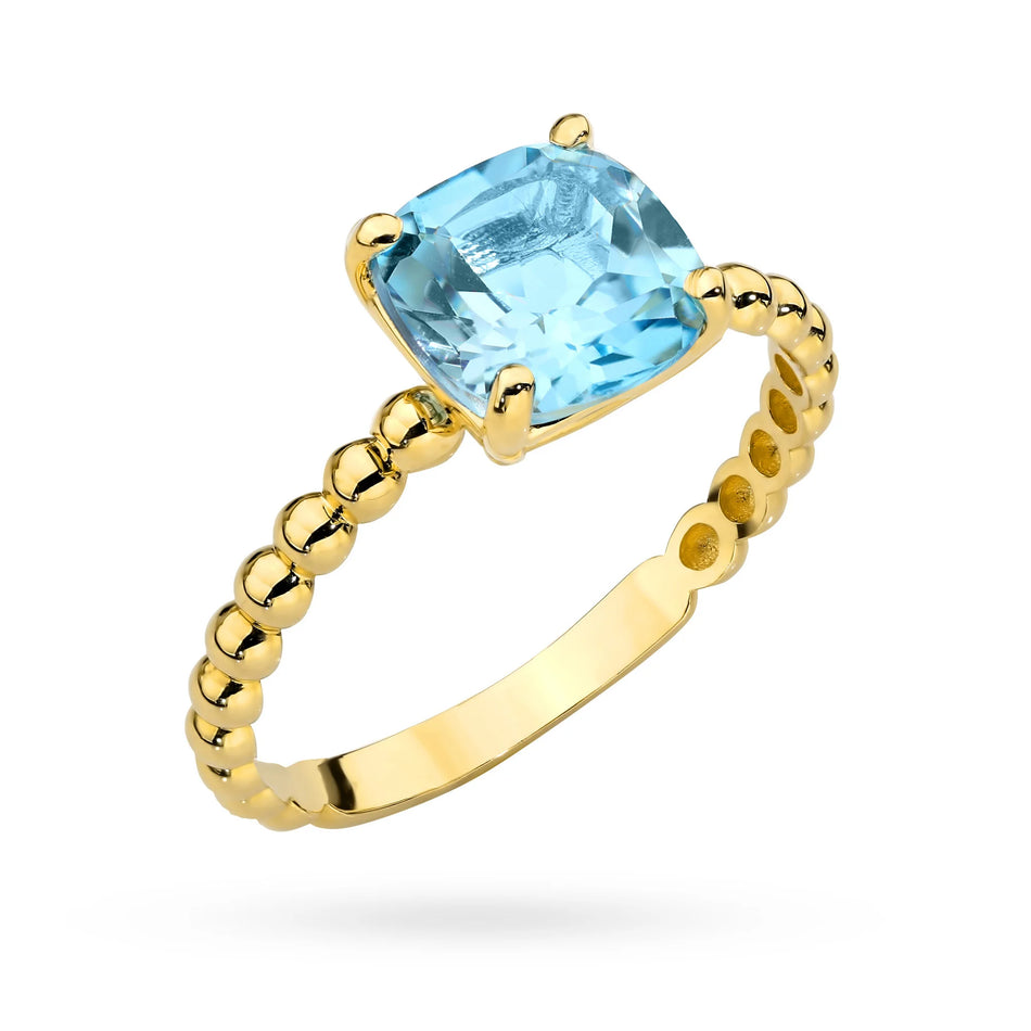 Prsteň zo zlatých korálok so štvorcovým modrým topásom