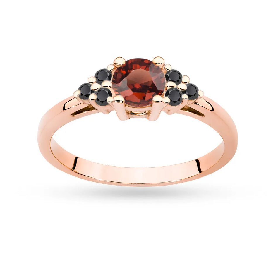 Gold Ring with 0,60ct Garnet and 6 Black Diamonds