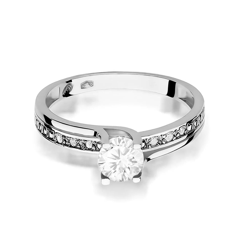 Zlatý prsteň s 0,60 ct bielym zafírom a 0,03 ct diamantmi